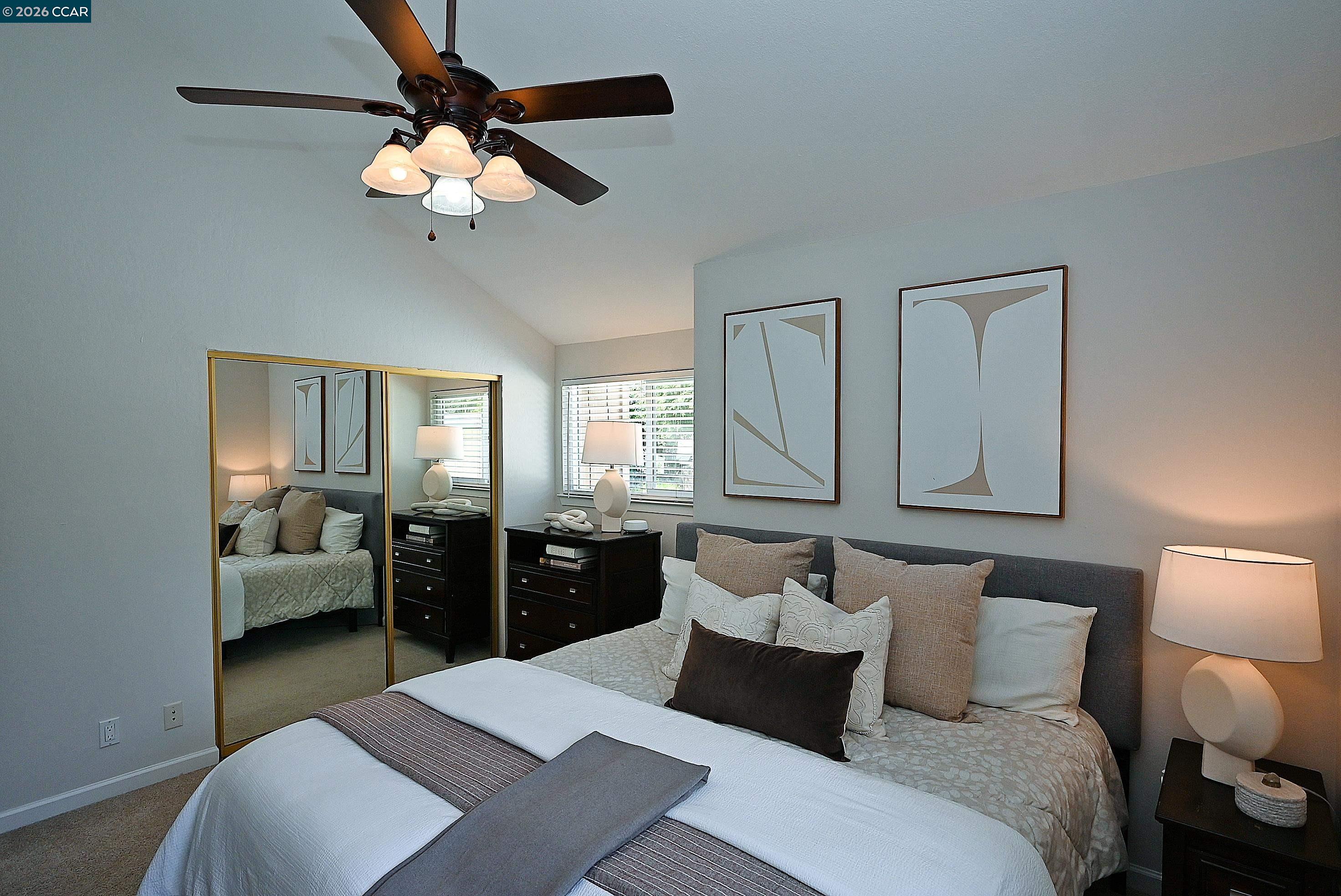 4284 Dubhe Court Concord, CA 94521 - Photo 29 of 46 a bedroom with a bed mirror and couch