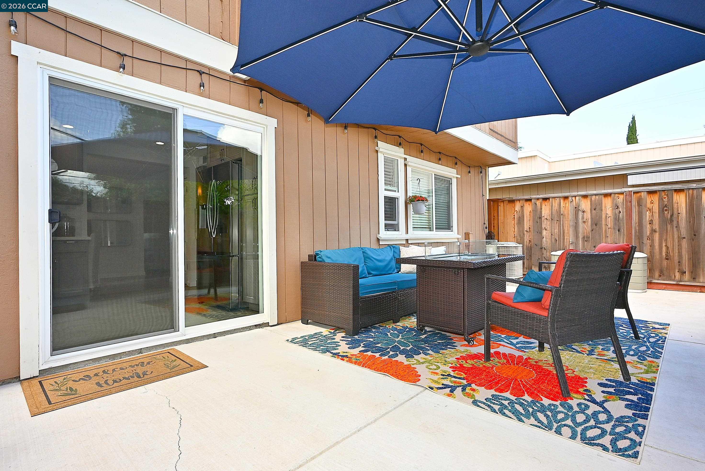 4284 Dubhe Court Concord, CA 94521 - Photo 33 of 46 a view of a patio with table and chairs under an umbrella