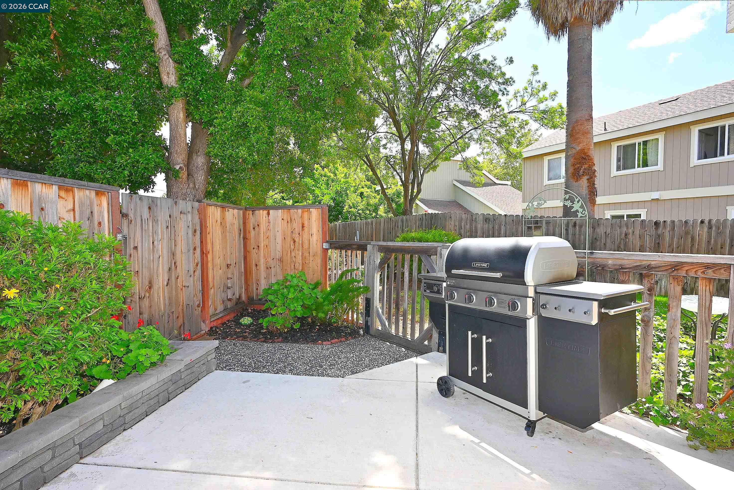 4284 Dubhe Court Concord, CA 94521 - Photo 37 of 46 a view of a fireplace with a tree in the background