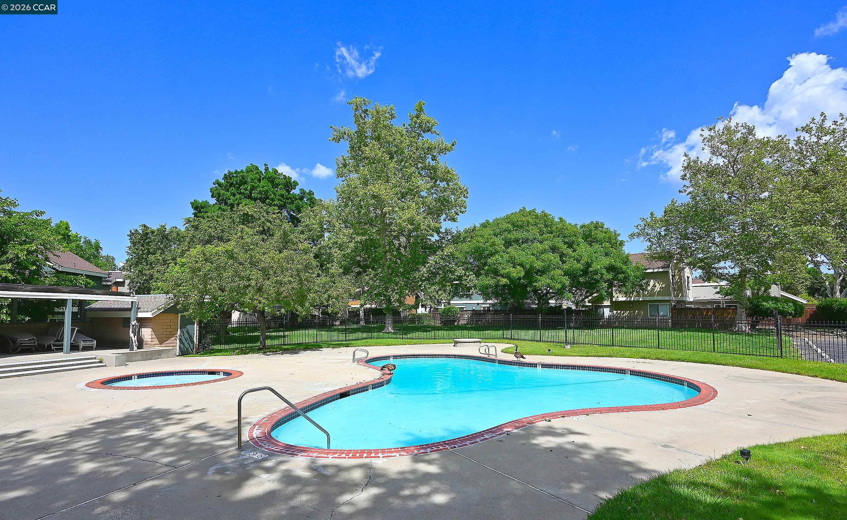 4284 Dubhe Court Concord, CA 94521 - Photo 45 of 46 a view of a swimming pool with an outdoor space and seating area