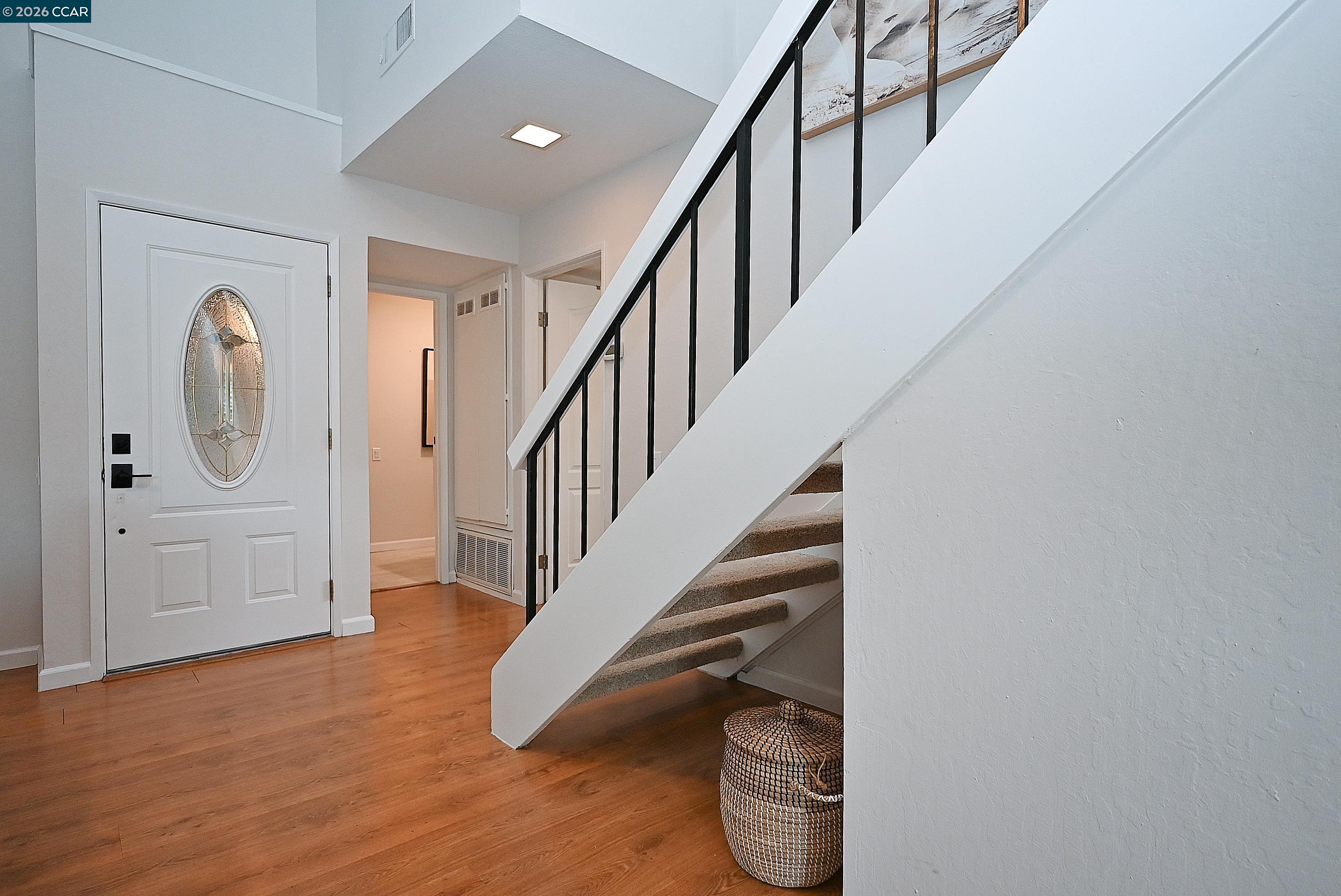 4284 Dubhe Court Concord, CA 94521 - Photo 9 of 46 a view of entryway and hall with wooden floor