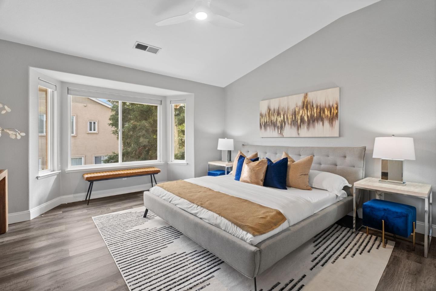 56 Lavender Court Tracy, CA 95376 - Photo 19 of 56 a bedroom with a large bed a couch and a window