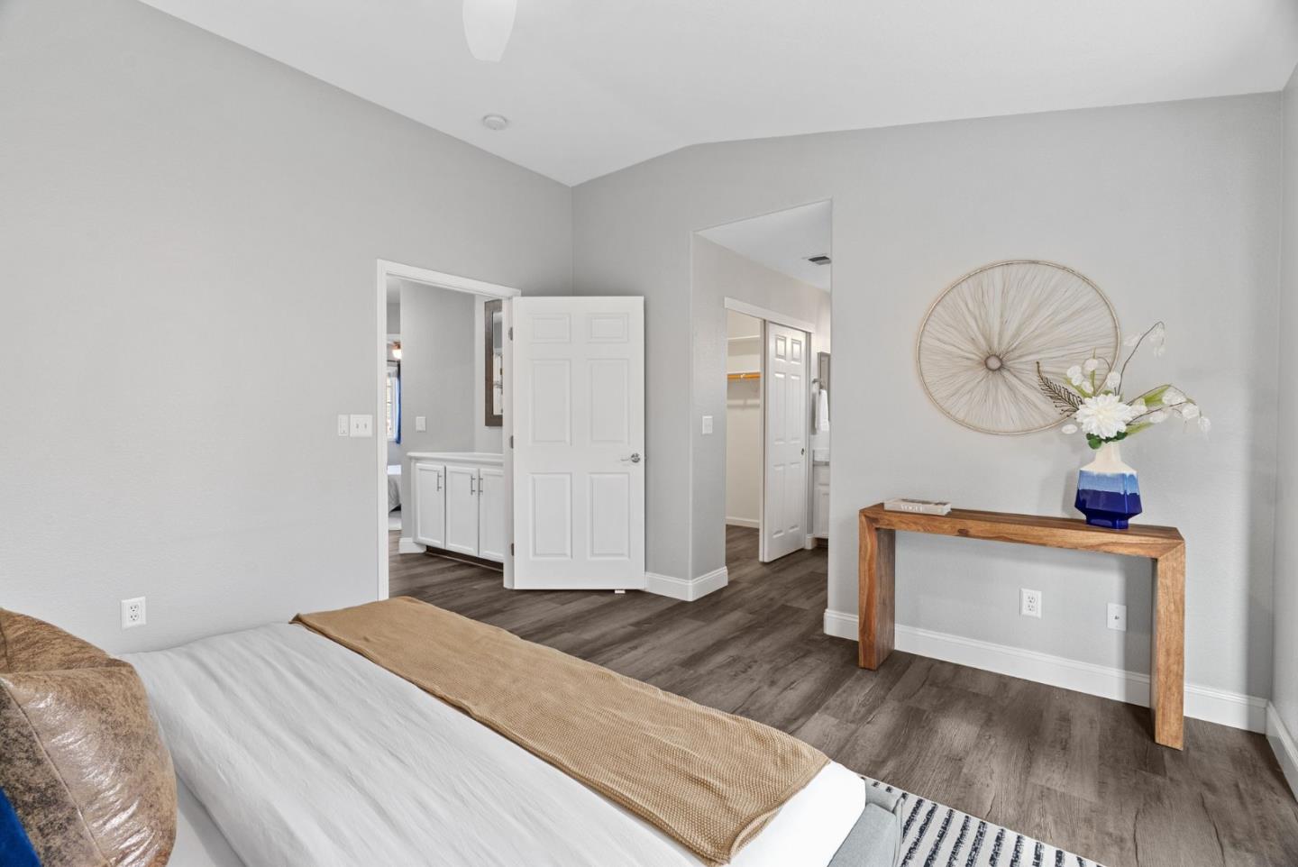 56 Lavender Court Tracy, CA 95376 - Photo 22 of 56 a bedroom with a bed and a chandelier