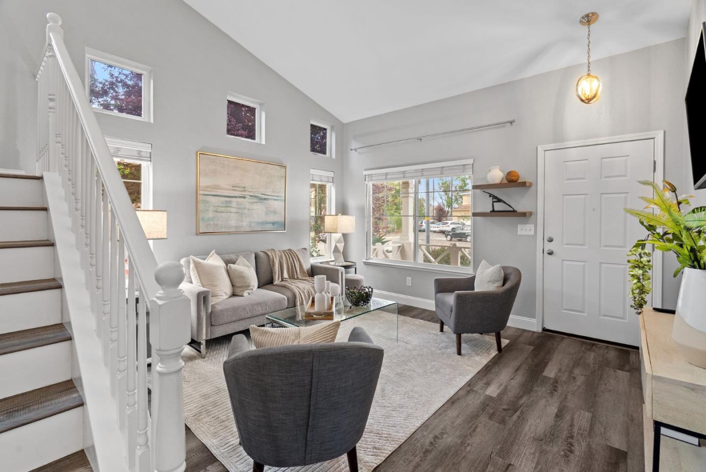 56 Lavender Court Tracy, CA 95376 - Photo 3 of 56 a living room with furniture floor to ceiling window and wooden floor