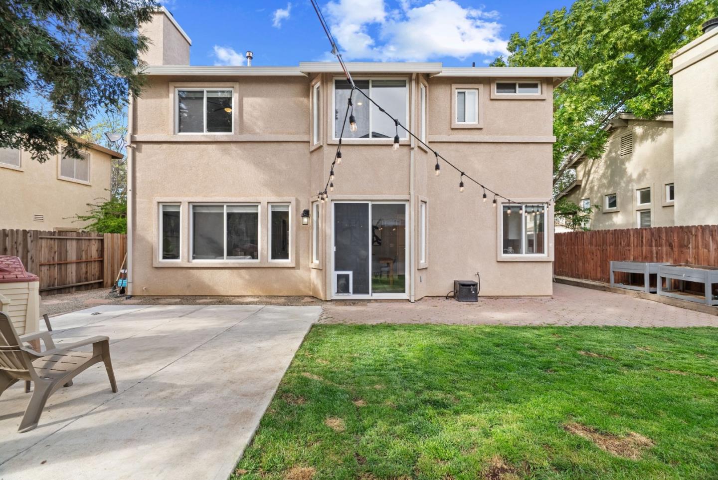 56 Lavender Court Tracy, CA 95376 - Photo 34 of 56 a front view of a house with a yard and seating space