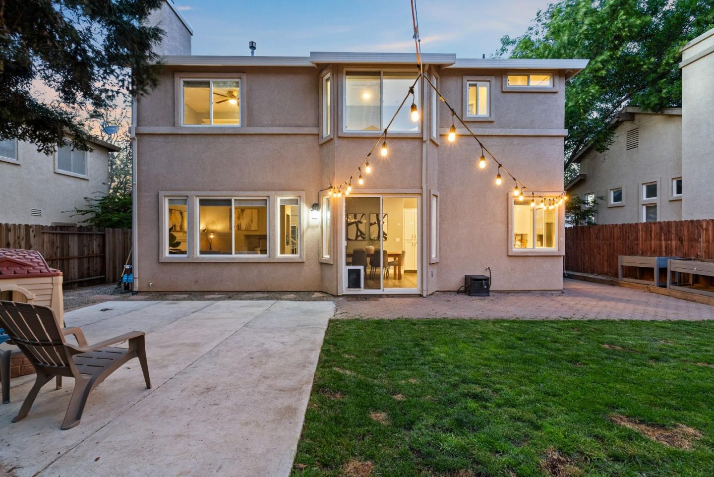 56 Lavender Court Tracy, CA 95376 - Photo 52 of 56 a view of a house with a backyard and a patio