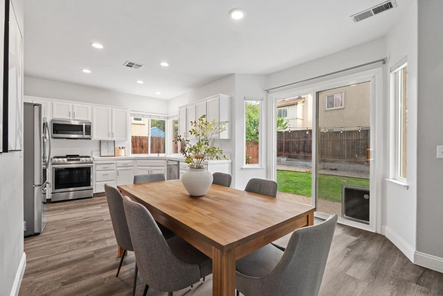 56 Lavender Court Tracy, CA 95376 - Photo 8 of 56 a view of a dining room with furniture window and wooden floor