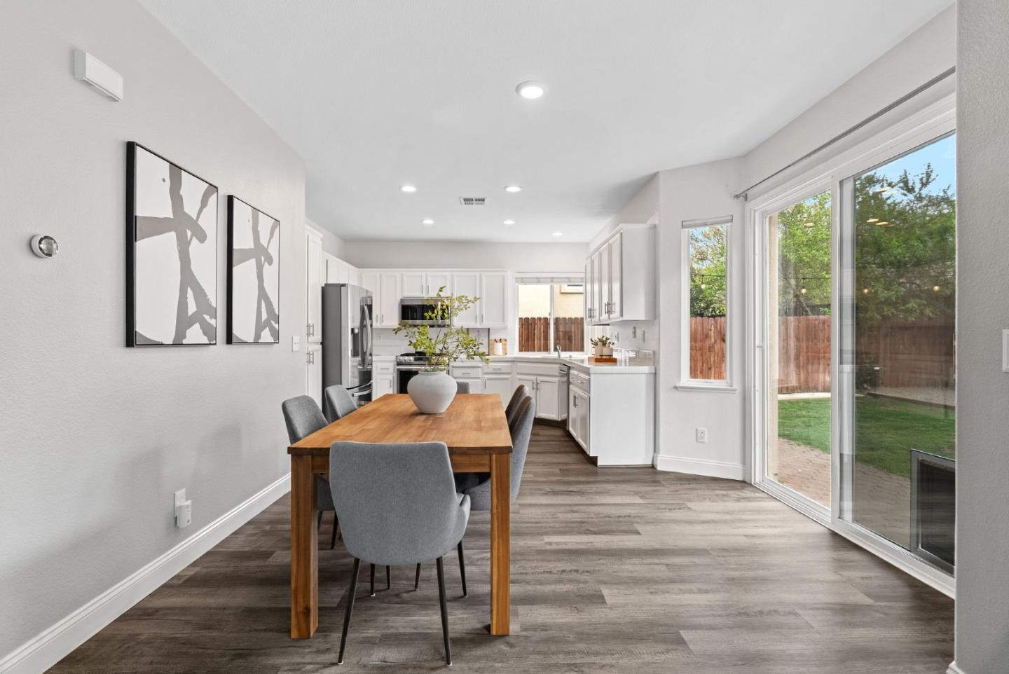56 Lavender Court Tracy, CA 95376 - Photo 9 of 56 a view of a dining room with furniture window and wooden floor