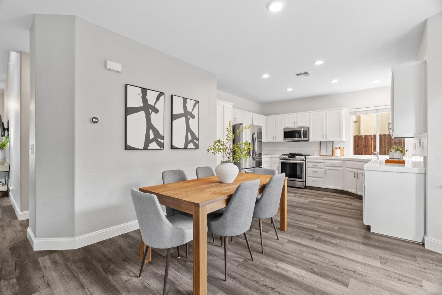 56 Lavender Court Tracy, CA 95376 - Photo 10 of 56 a view of a dining room with furniture and wooden floor