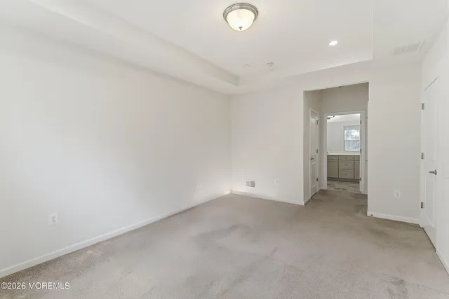 a bathroom with a shower sink and mirror