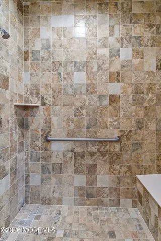 a view of an empty room with wall space and window