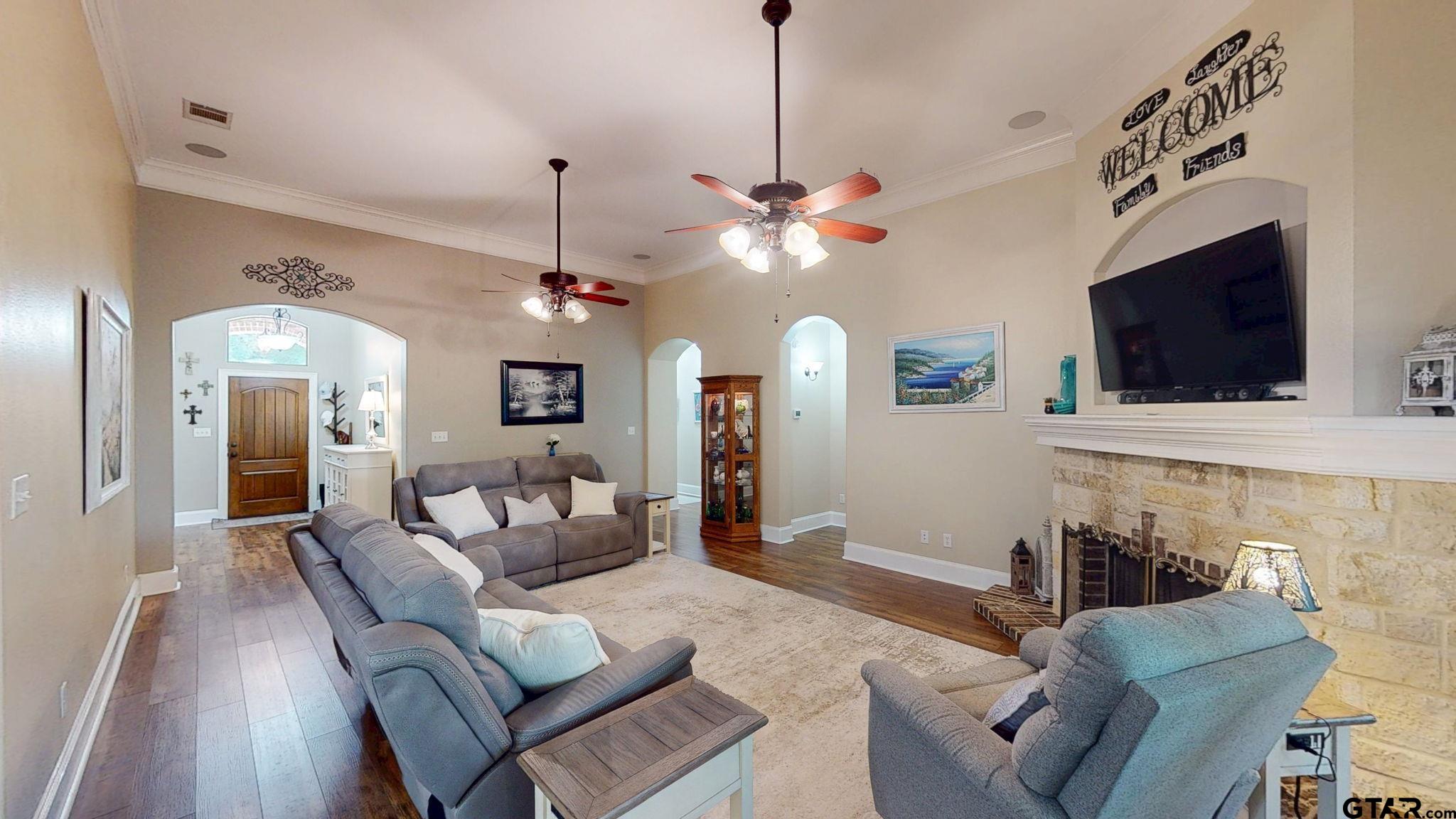 18488 Bluebird Circle Flint, TX 75762 - Photo 8 of 47 a living room with furniture a flat screen tv and a ceiling fan
