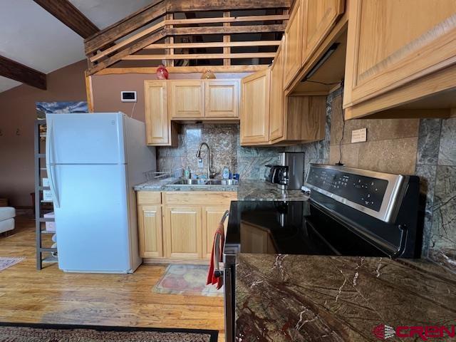 31 Castle Road, Unit 5 Crested Butte, CO 81225 - Photo 13 of 24 a kitchen with refrigerator and stove