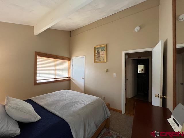 31 Castle Road, Unit 5 Crested Butte, CO 81225 - Photo 14 of 24 a bedroom with a bed and wooden floor