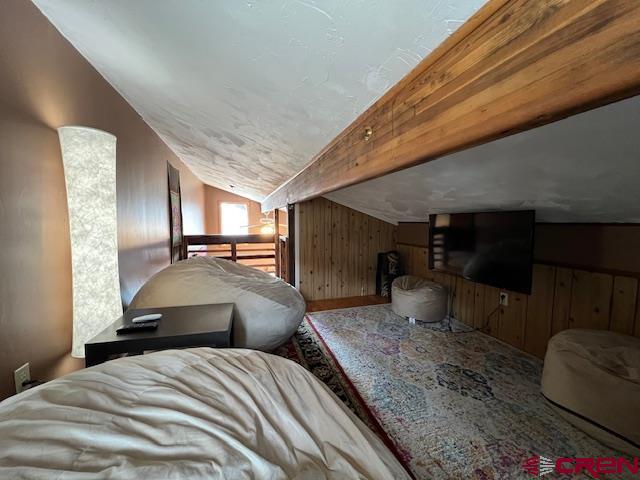 31 Castle Road, Unit 5 Crested Butte, CO 81225 - Photo 20 of 24 a bedroom with a bed a mirror and windows