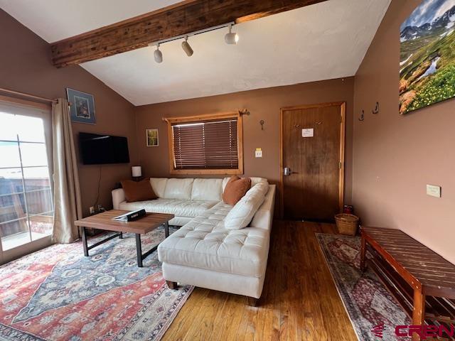 31 Castle Road, Unit 5 Crested Butte, CO 81225 - Photo 3 of 24 a living room with furniture and a flat screen tv