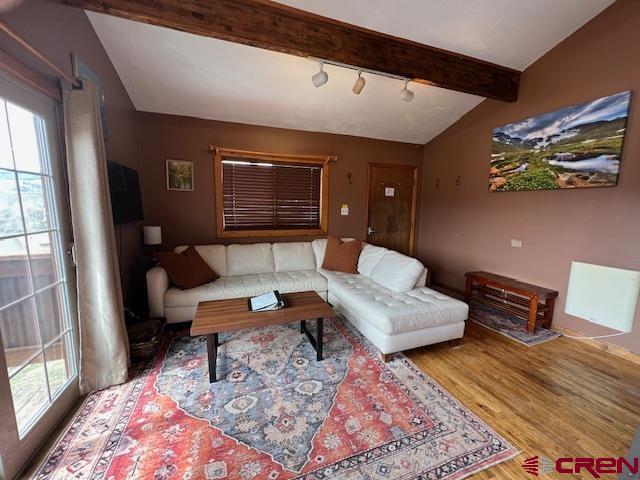 31 Castle Road, Unit 5 Crested Butte, CO 81225 - Photo 4 of 24 a living room with furniture and wooden floor