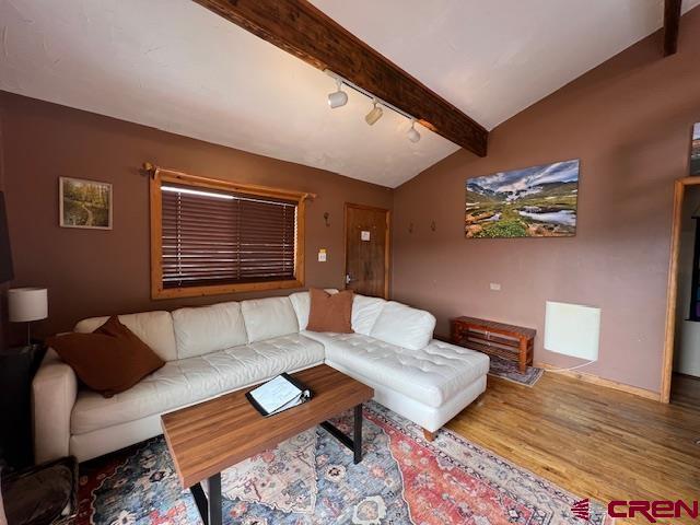 31 Castle Road, Unit 5 Crested Butte, CO 81225 - Photo 8 of 24 a living room with furniture and wooden floor