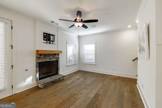 a view of a kitchen with wooden floor and a kitchen