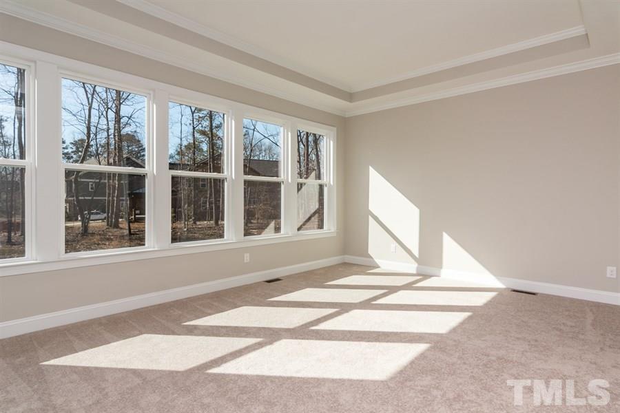 8121 Greys Landing Way, Unit 10 Raleigh, NC 27615 - Photo 8 of 14 Sample photo of vaulted ceiling in luxurious master suite