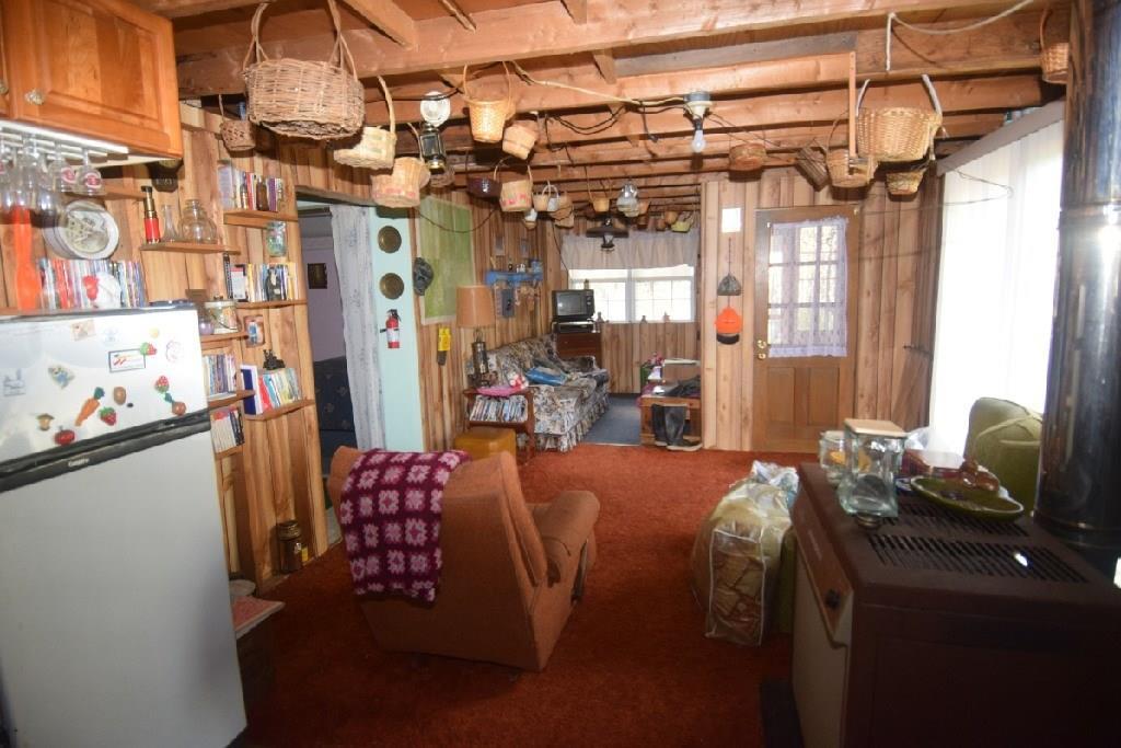 261 Oliver Road New Portland, ME 04961 - Photo 6 of 15 View of entrance and family area...
