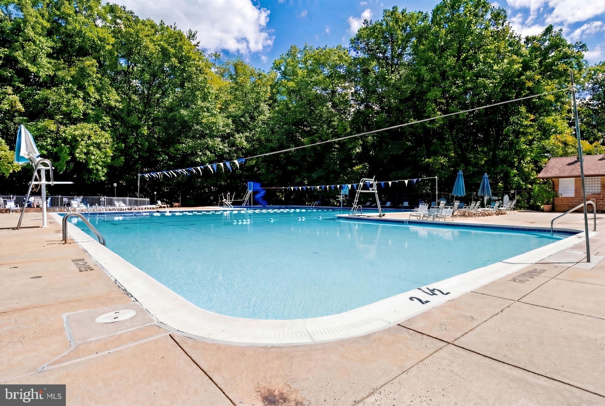 10600 Vantage Court Potomac, MD 20854 - Photo 83 of 91 a view of a swimming pool with a bench in the background