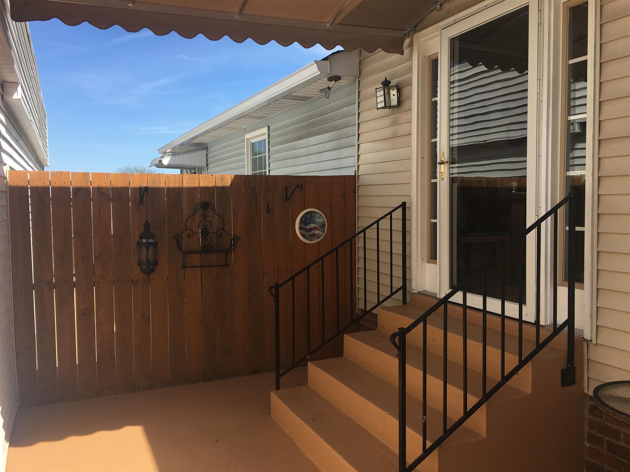 1409 Lewis Road Madison, TN 37115 - Photo 3 of 21 Enclosed Private Patio for your enjoyment- I have a new covered Awning between Garage and Condo!