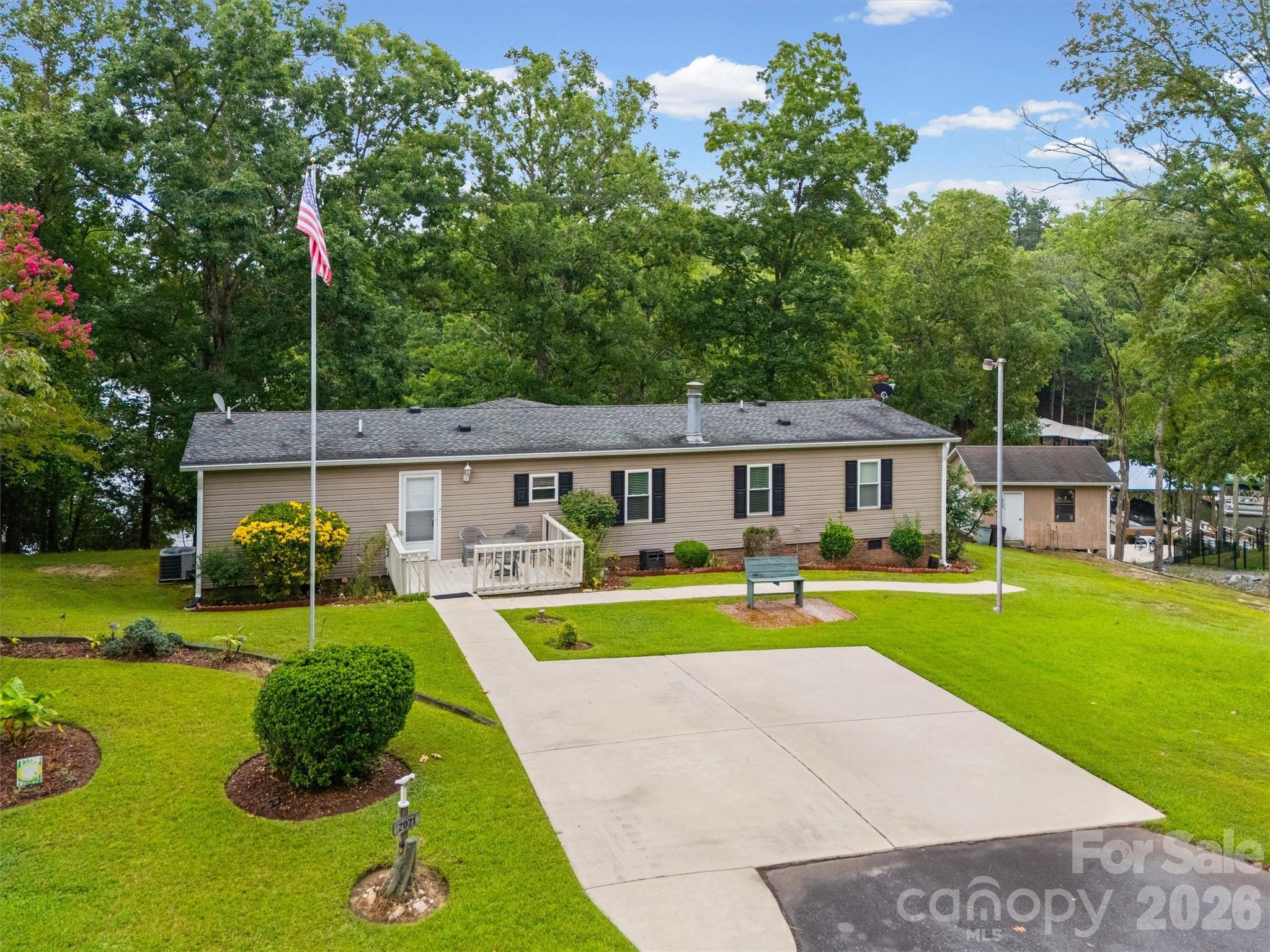 2071 Chameleon Road, Unit 156 York, SC 29745 - Photo 35 of 46 a view of a house with a swimming pool and a yard