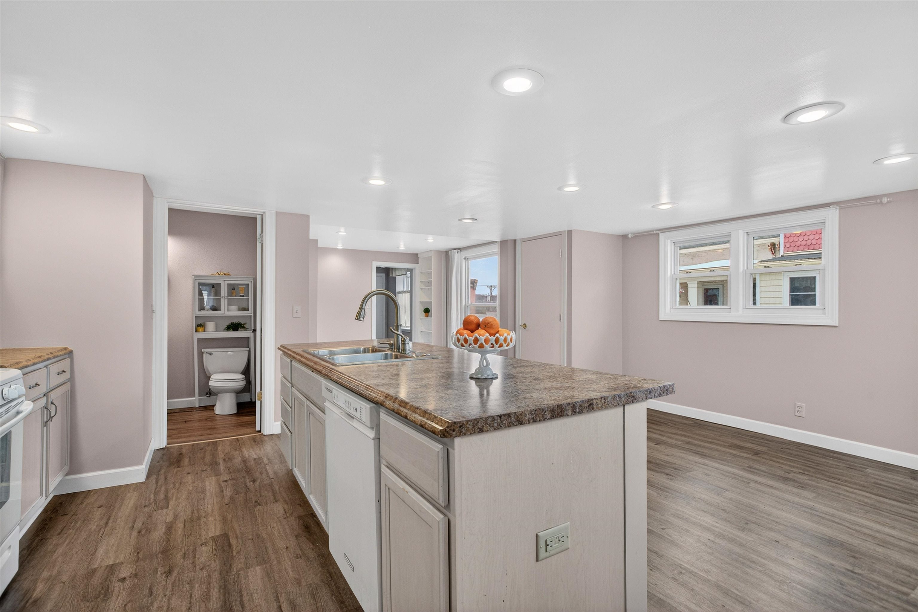 118 North Cody Road Leclaire, IA 52753 - Photo 27 of 42 a view of a kitchen counter space with wooden floor and stainless steel appliances