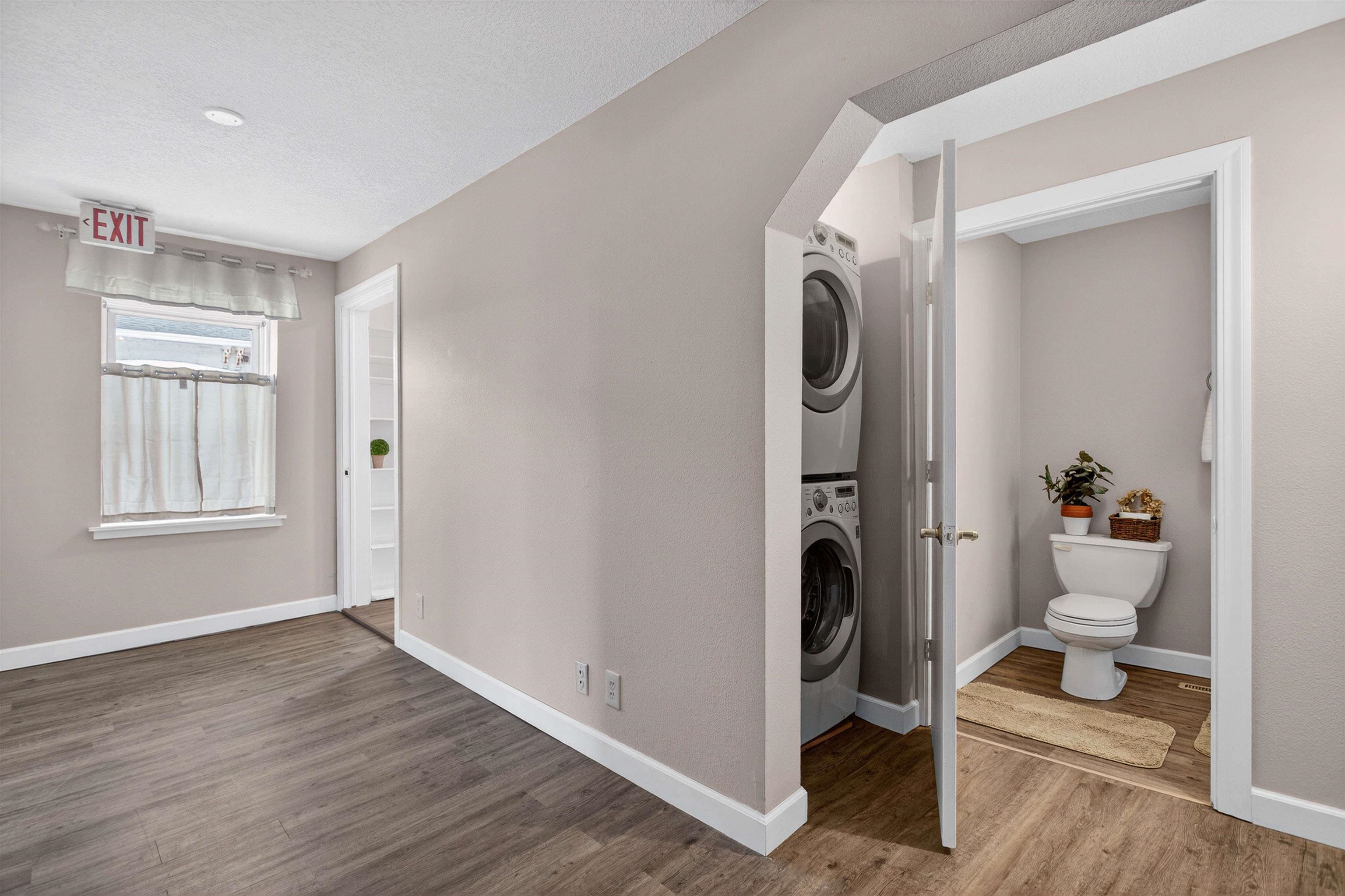 118 North Cody Road Leclaire, IA 52753 - Photo 30 of 42 a bathroom with a toilet and a window
