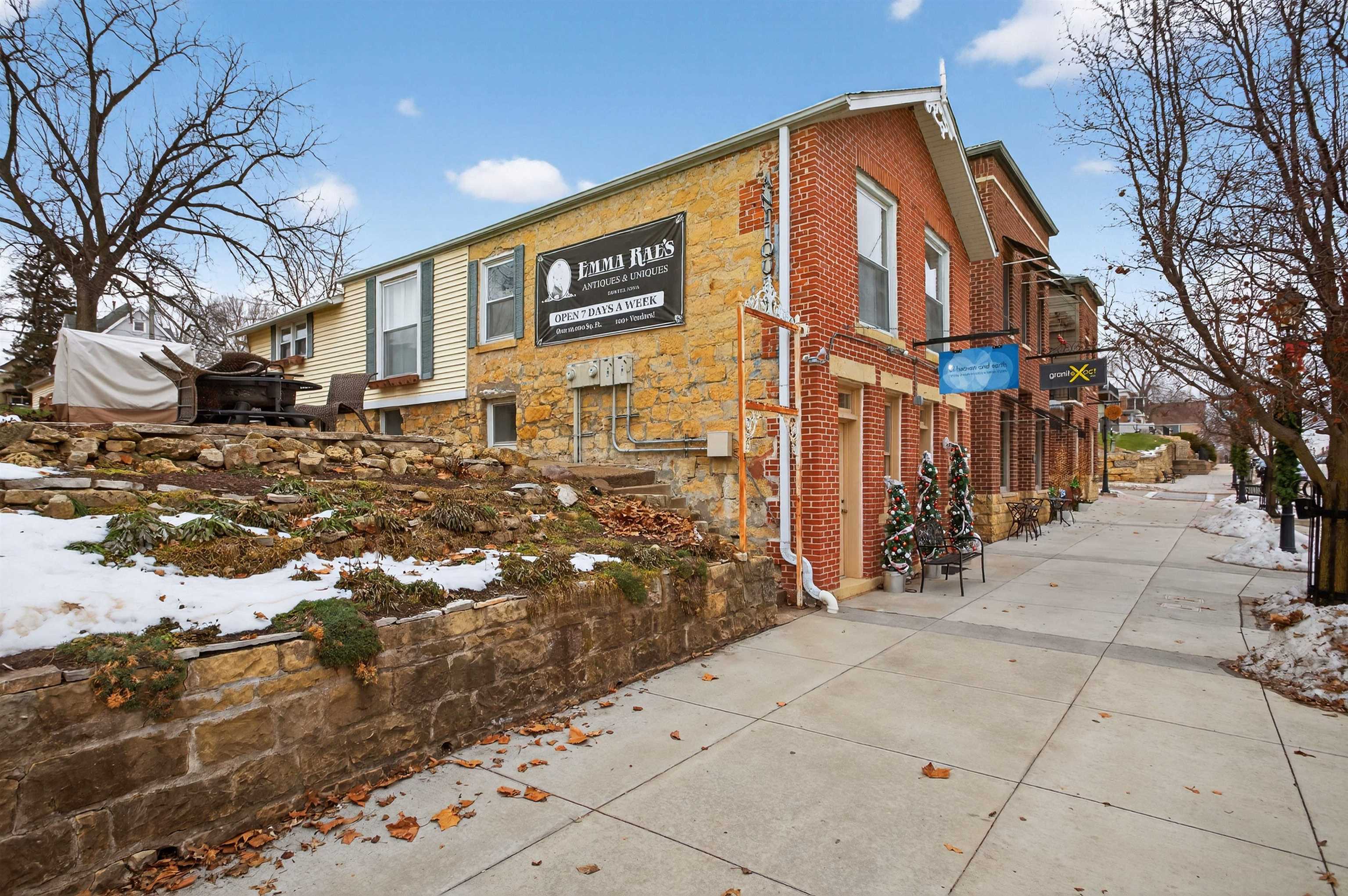 118 North Cody Road Leclaire, IA 52753 - Photo 3 of 42 a view of a blue house with a yard