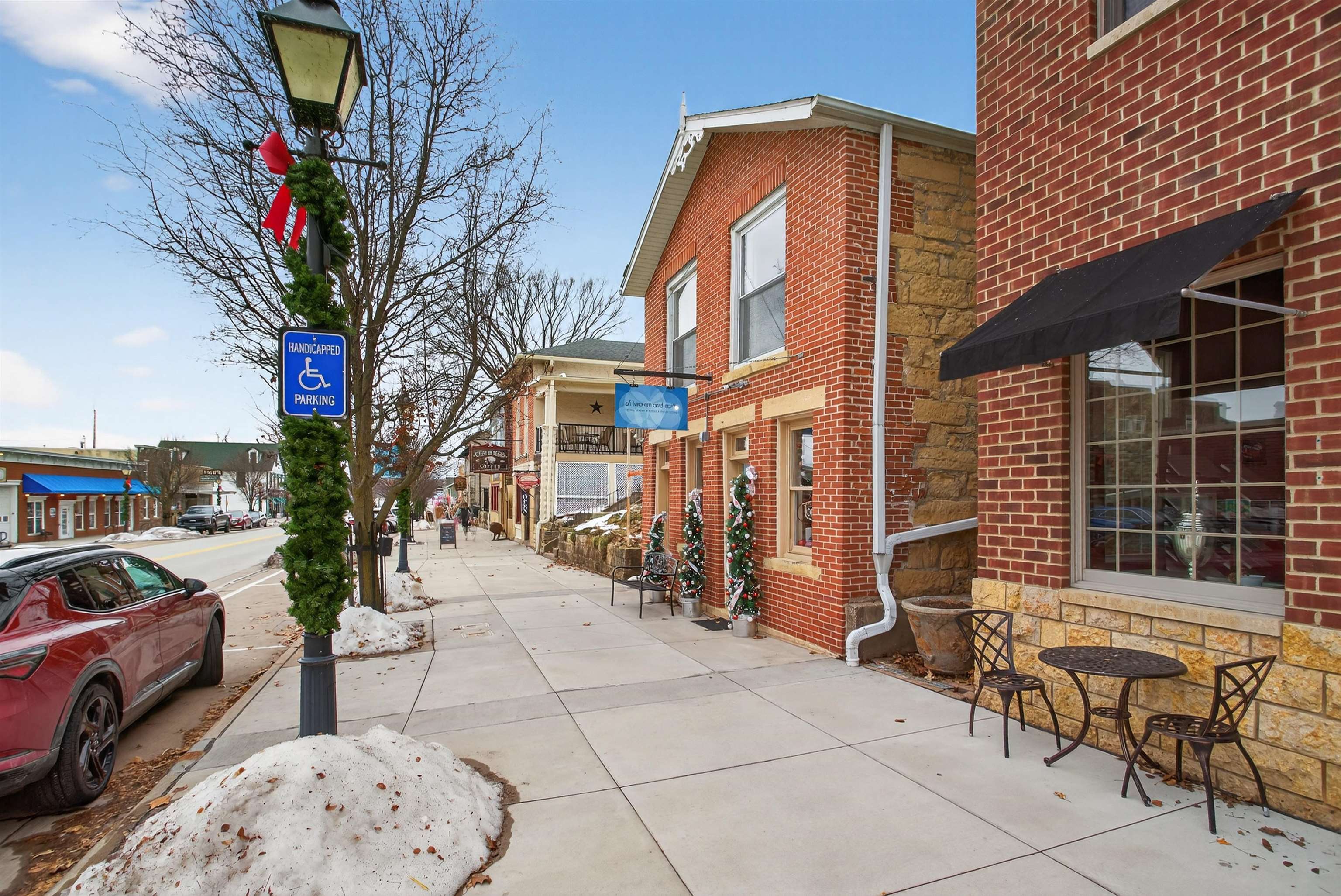 118 North Cody Road Leclaire, IA 52753 - Photo 4 of 42 a view of a brick house with many windows