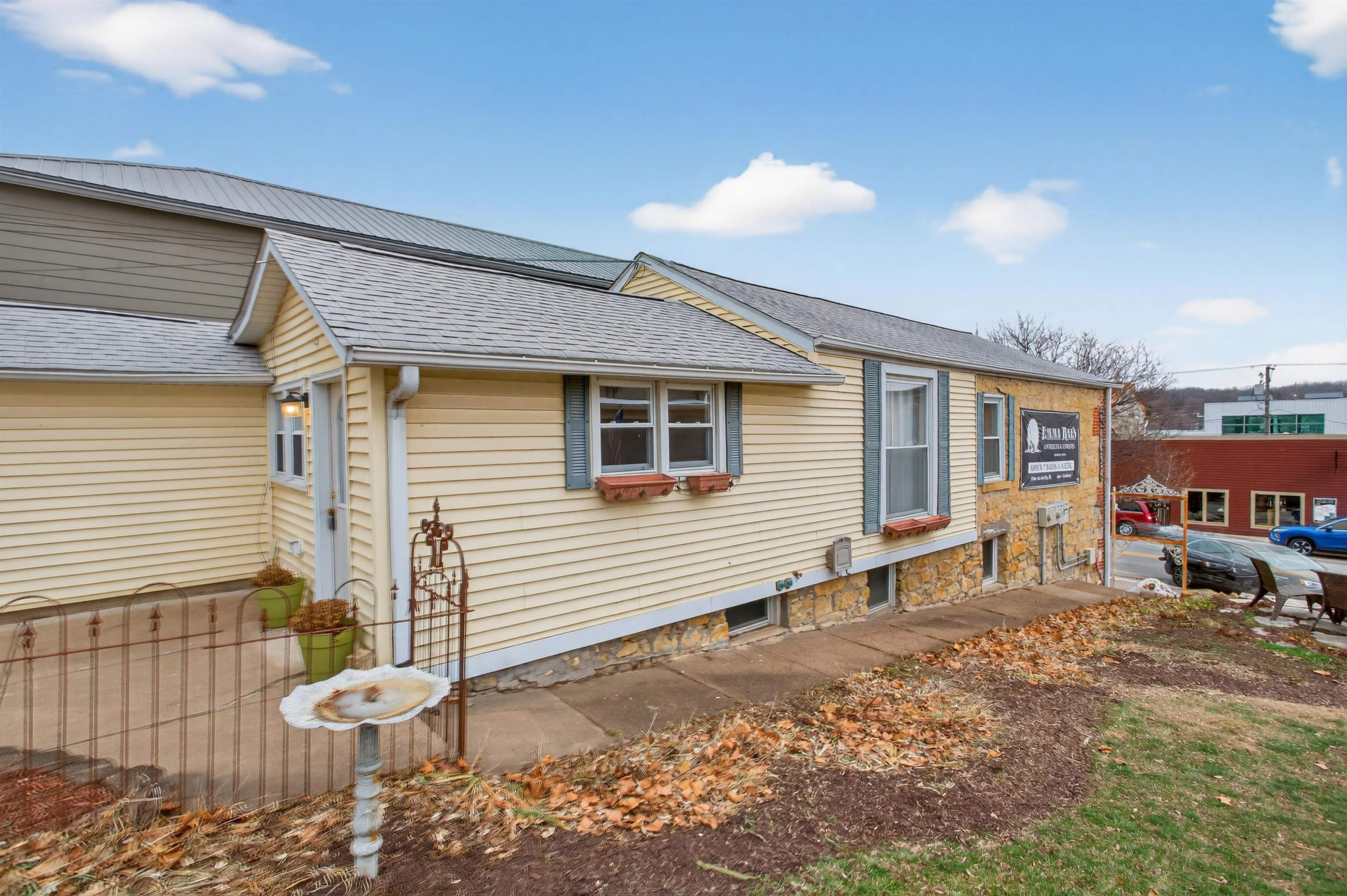 118 North Cody Road Leclaire, IA 52753 - Photo 7 of 42 a backyard of a house with barbeque oven table and chairs
