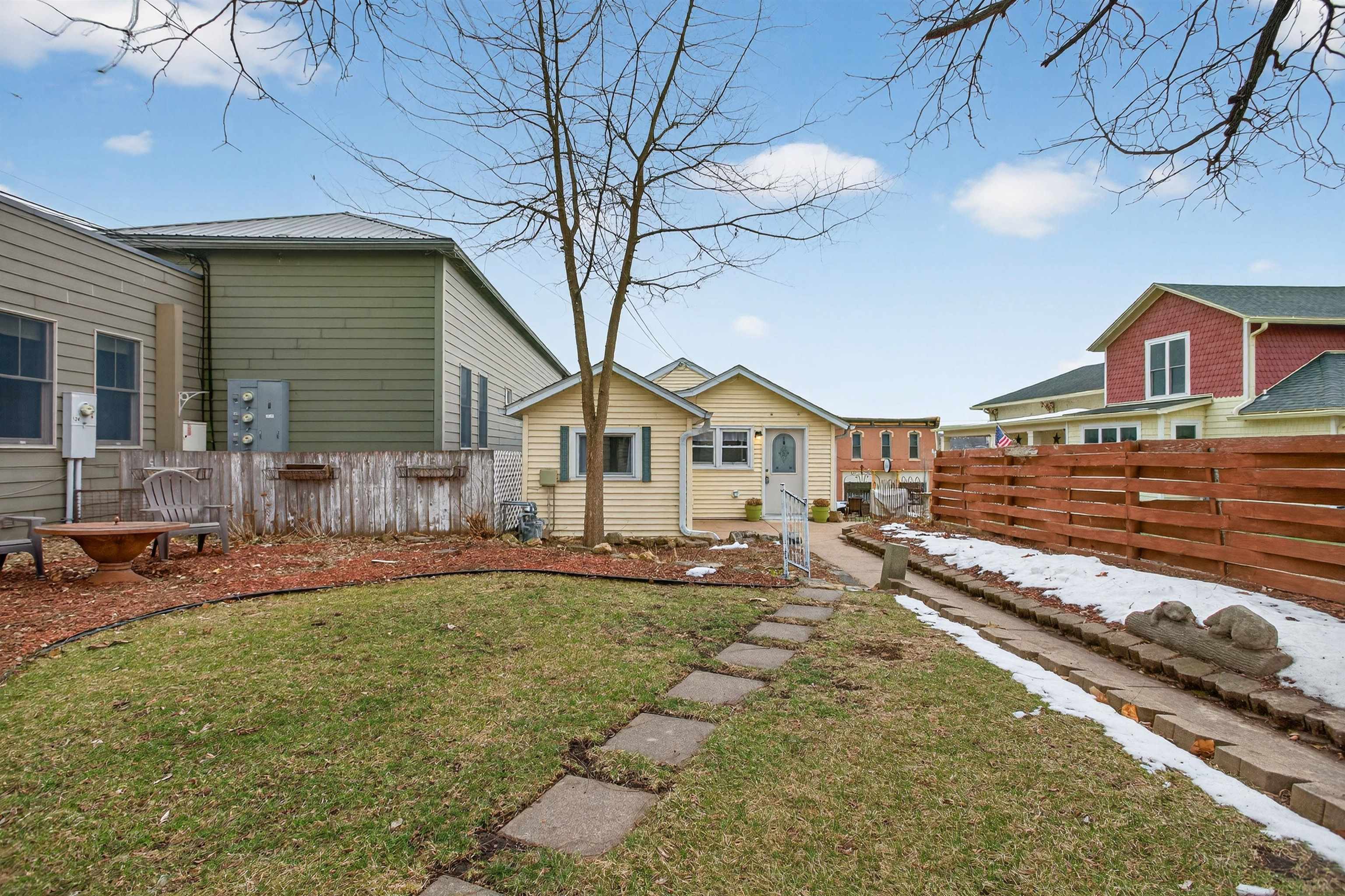 118 North Cody Road Leclaire, IA 52753 - Photo 8 of 42 a front view of a house with a yard