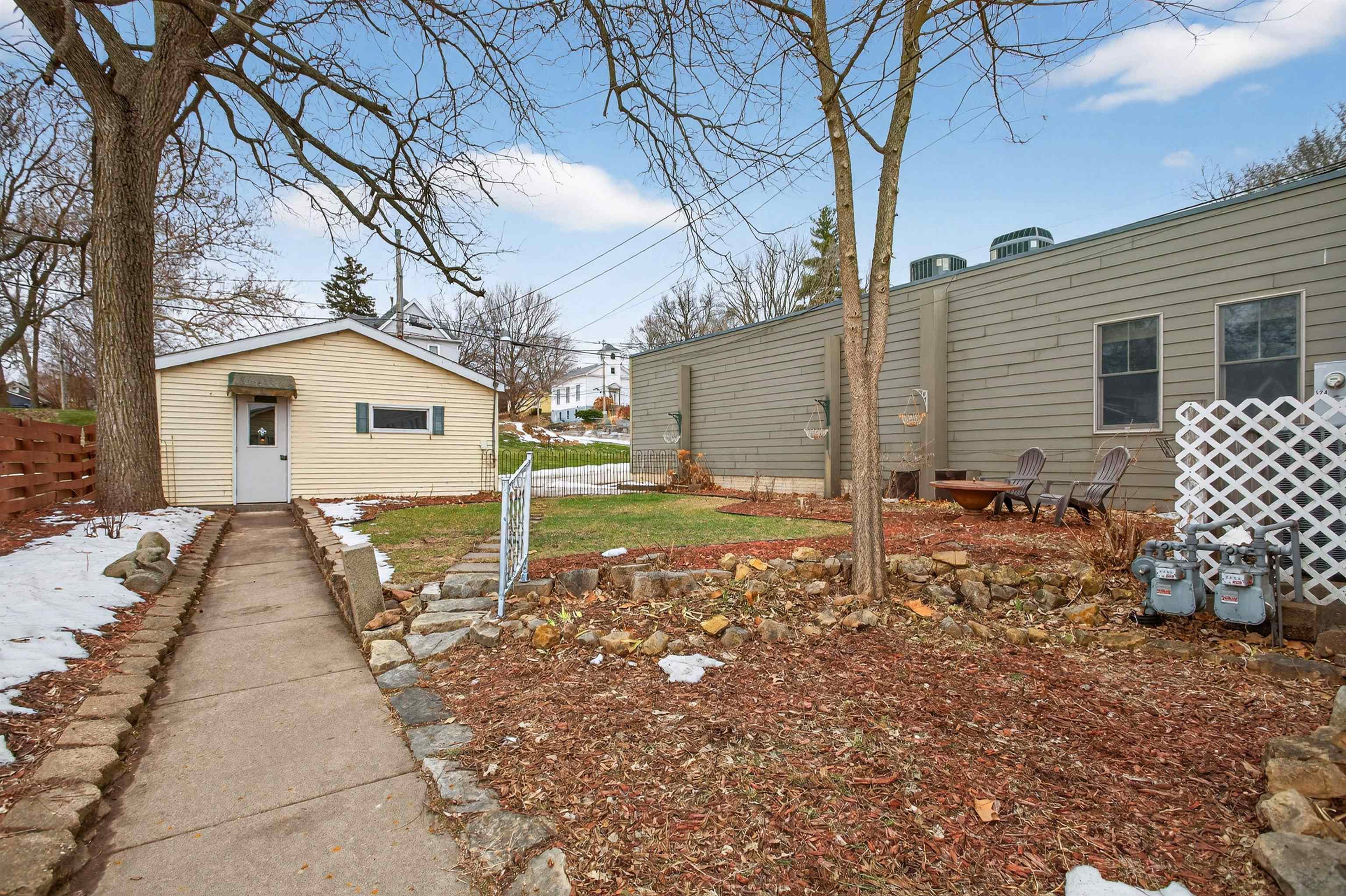 118 North Cody Road Leclaire, IA 52753 - Photo 10 of 42 a backyard of a house with table and chairs
