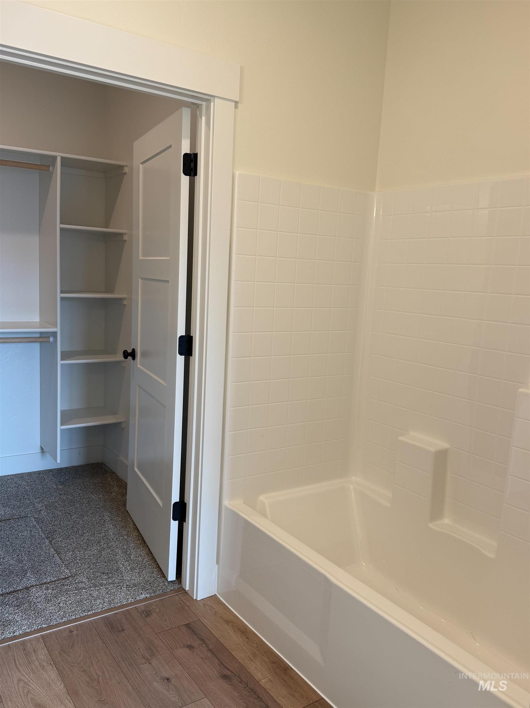 235 Whitman Street Albion, ID 83311 - Photo 12 of 23 Full bathroom featuring dark wood-style floors and shower / washtub combination