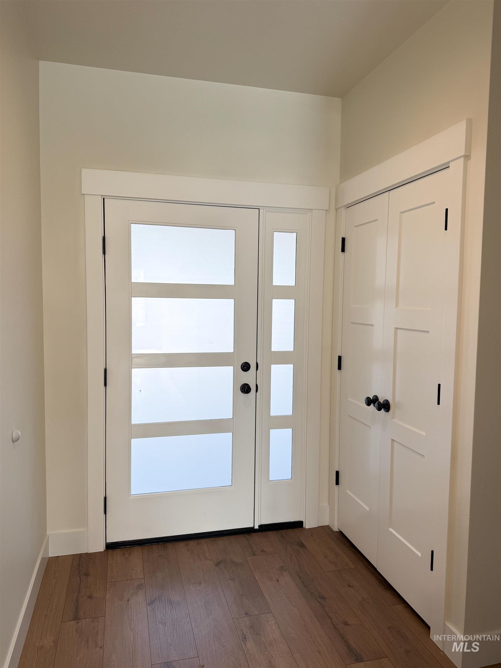 235 Whitman Street Albion, ID 83311 - Photo 16 of 23 Doorway to outside with hardwood / wood-style floors and baseboards