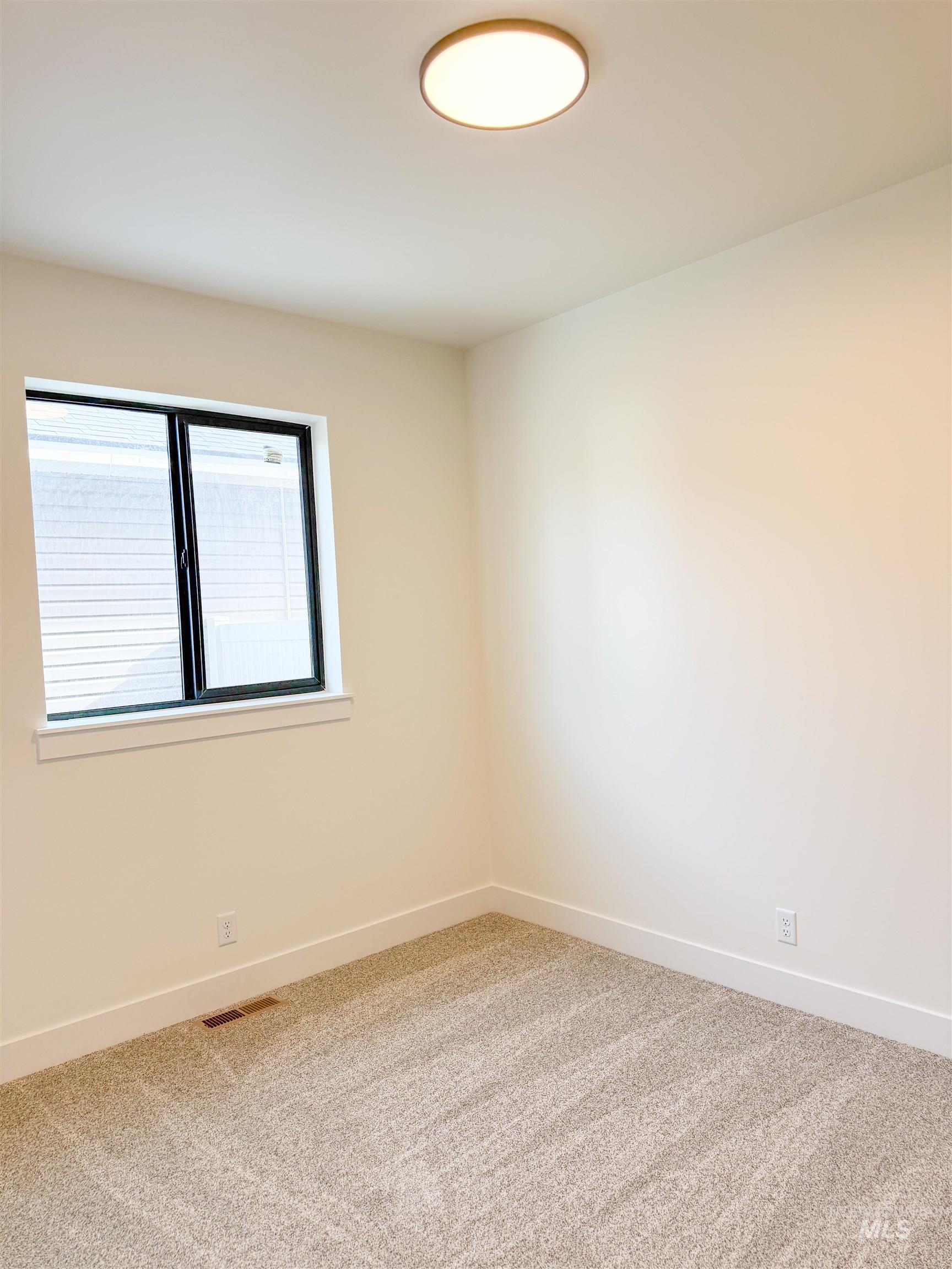 235 Whitman Street Albion, ID 83311 - Photo 17 of 23 Empty room featuring light colored carpet and baseboards