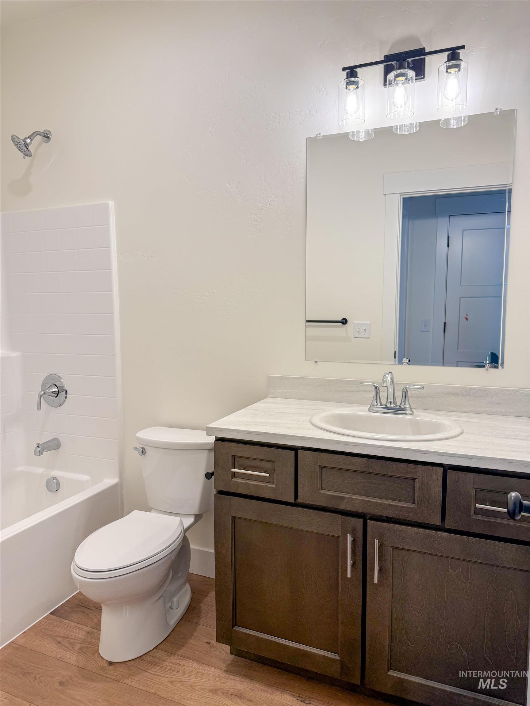235 Whitman Street Albion, ID 83311 - Photo 18 of 23 Full bath featuring vanity, shower / tub combination, and light wood-style flooring