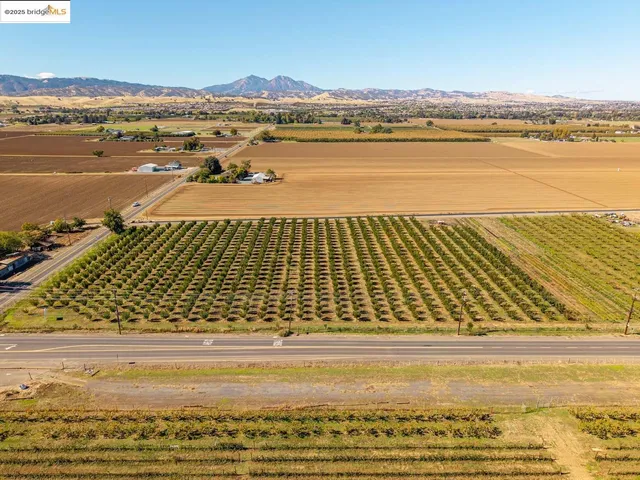 a view of a cars park in front of building
