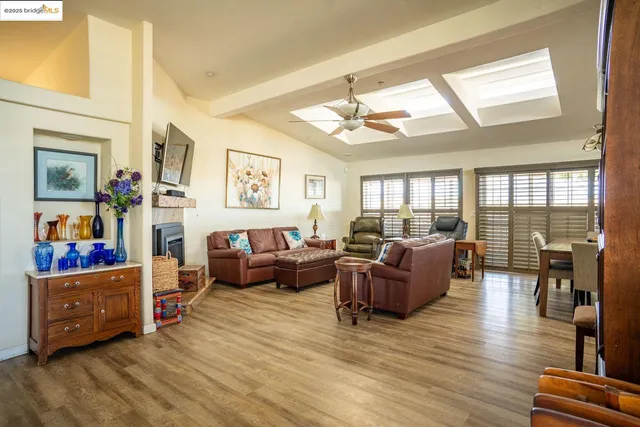 a view of a dining room with furniture and window