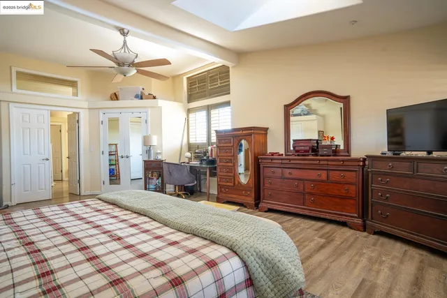 a bathroom with a sink a large mirror and a bathtub
