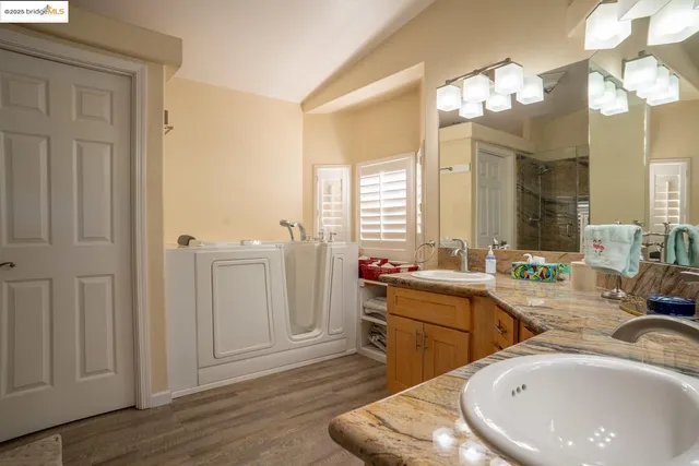 a bathroom with a sink vanity and a mirror