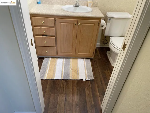a view of a chair and tables in the patio