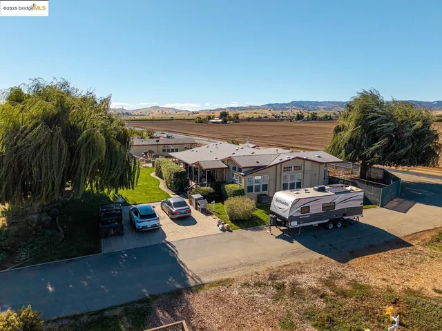 an aerial view of a house with a ocean view