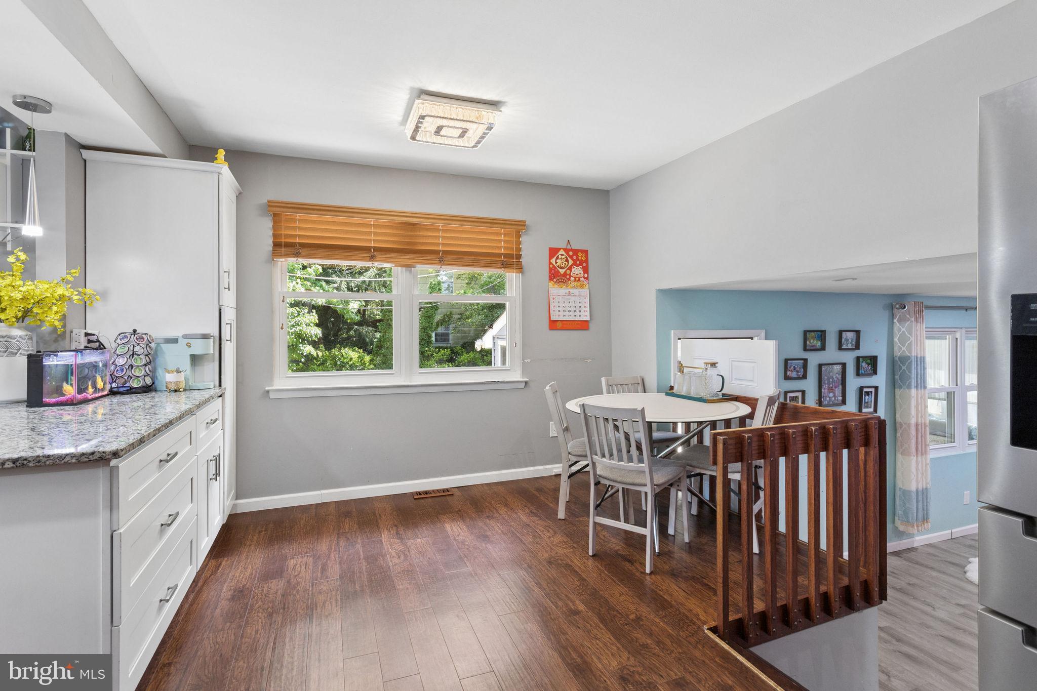 252 Sandringham Road Cherry Hill, NJ 08003 - Photo 11 of 31 a dining room with furniture and wooden floor