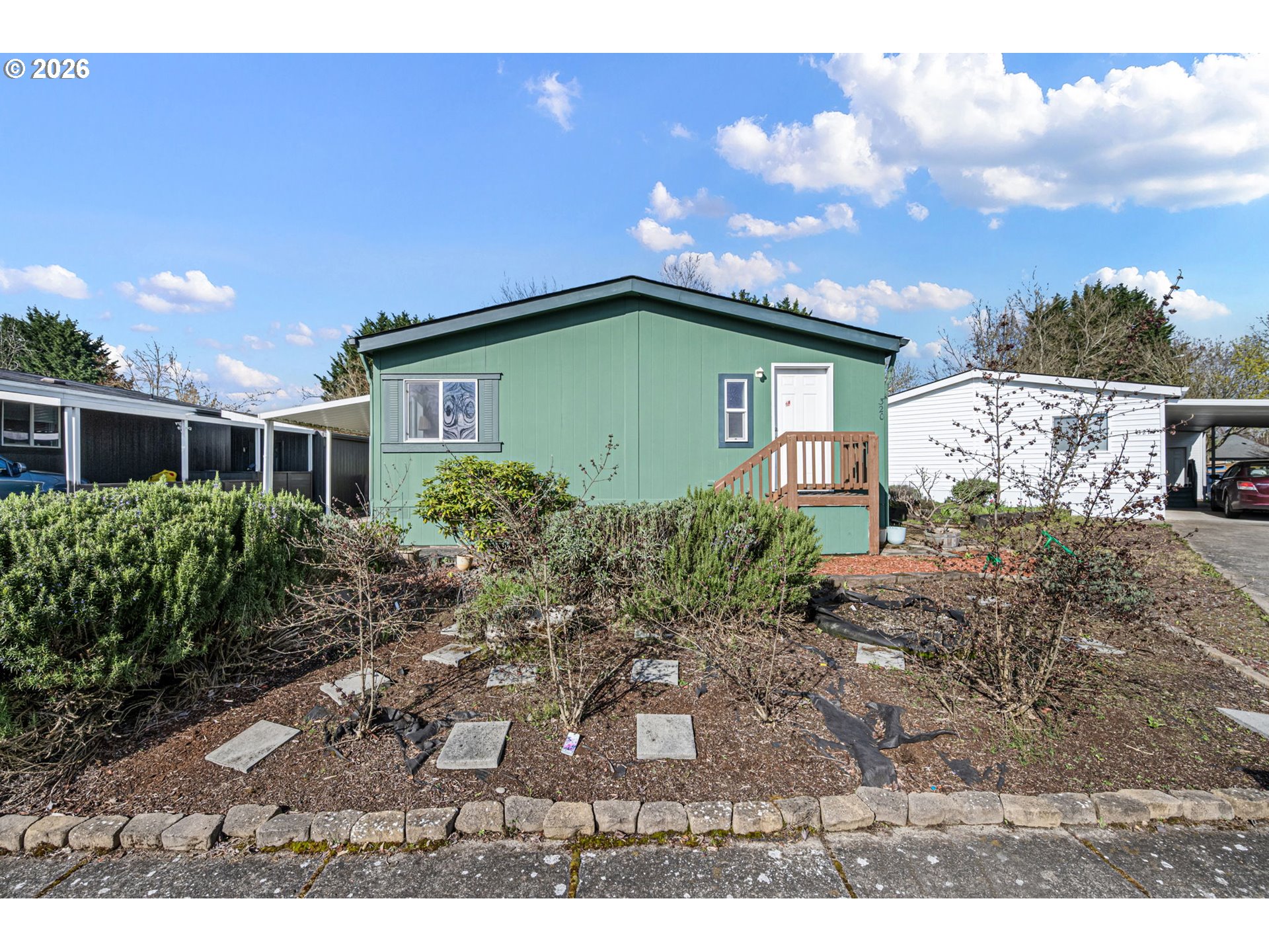 1699 North Terry Street, Unit 320 Eugene, OR 97402 - Photo 12 of 36 a front view of a house with garden