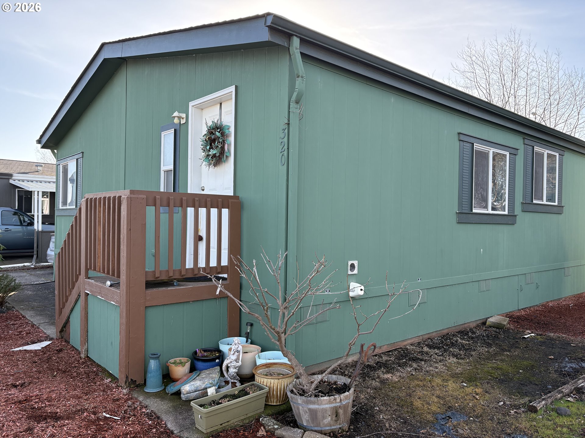 1699 North Terry Street, Unit 320 Eugene, OR 97402 - Photo 2 of 36 a front view of a house with garden