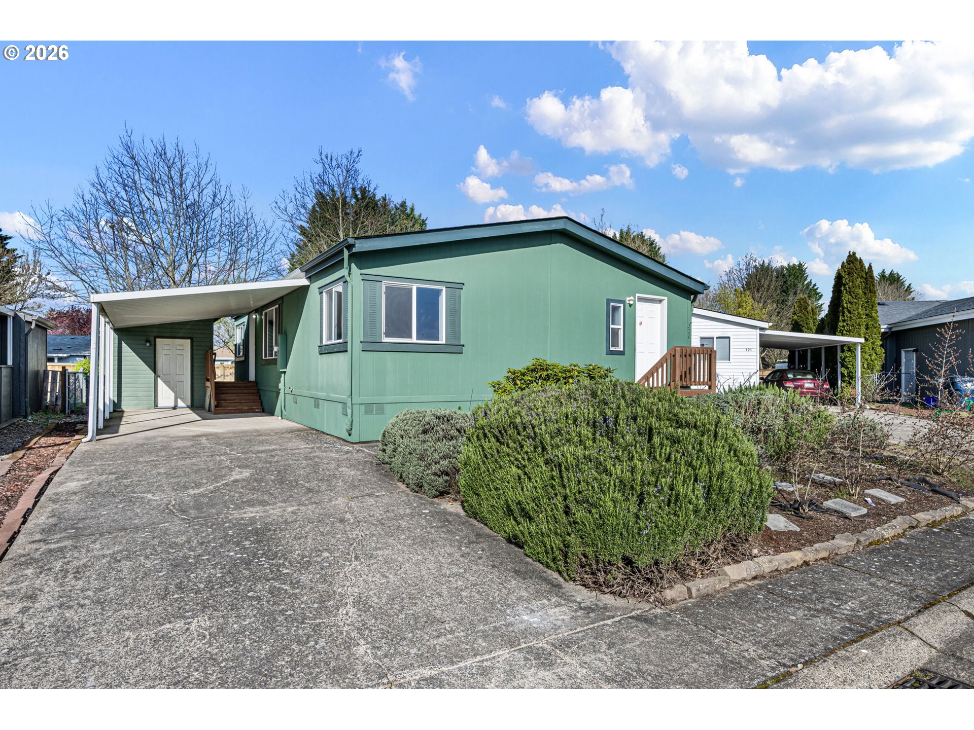 1699 North Terry Street, Unit 320 Eugene, OR 97402 - Photo 23 of 36 a front view of a house with garden