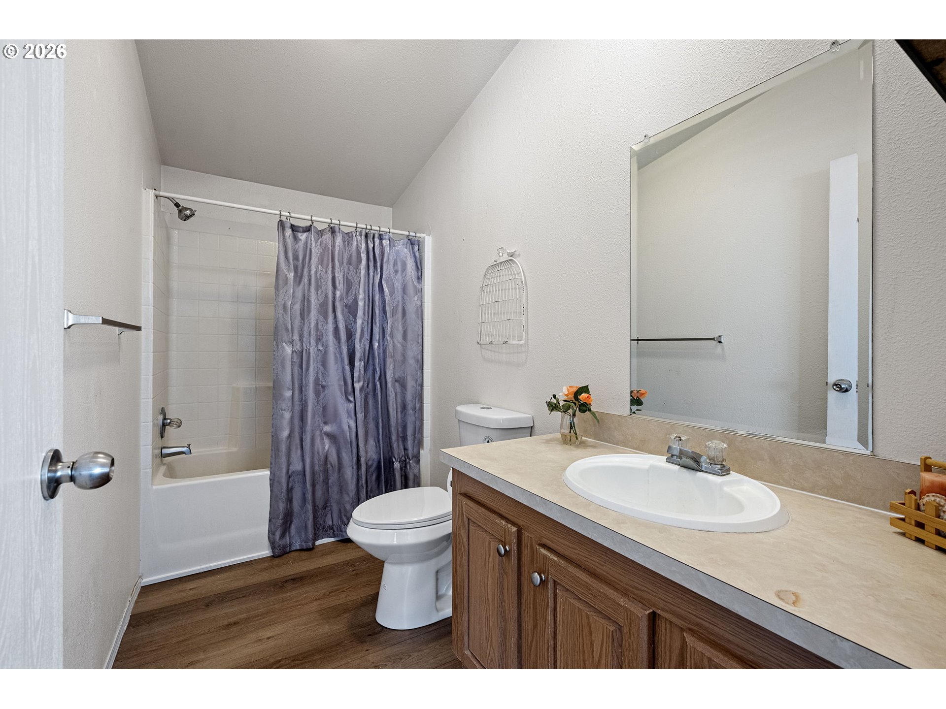 1699 North Terry Street, Unit 320 Eugene, OR 97402 - Photo 24 of 36 a bathroom with a sink toilet a shower and a mirror